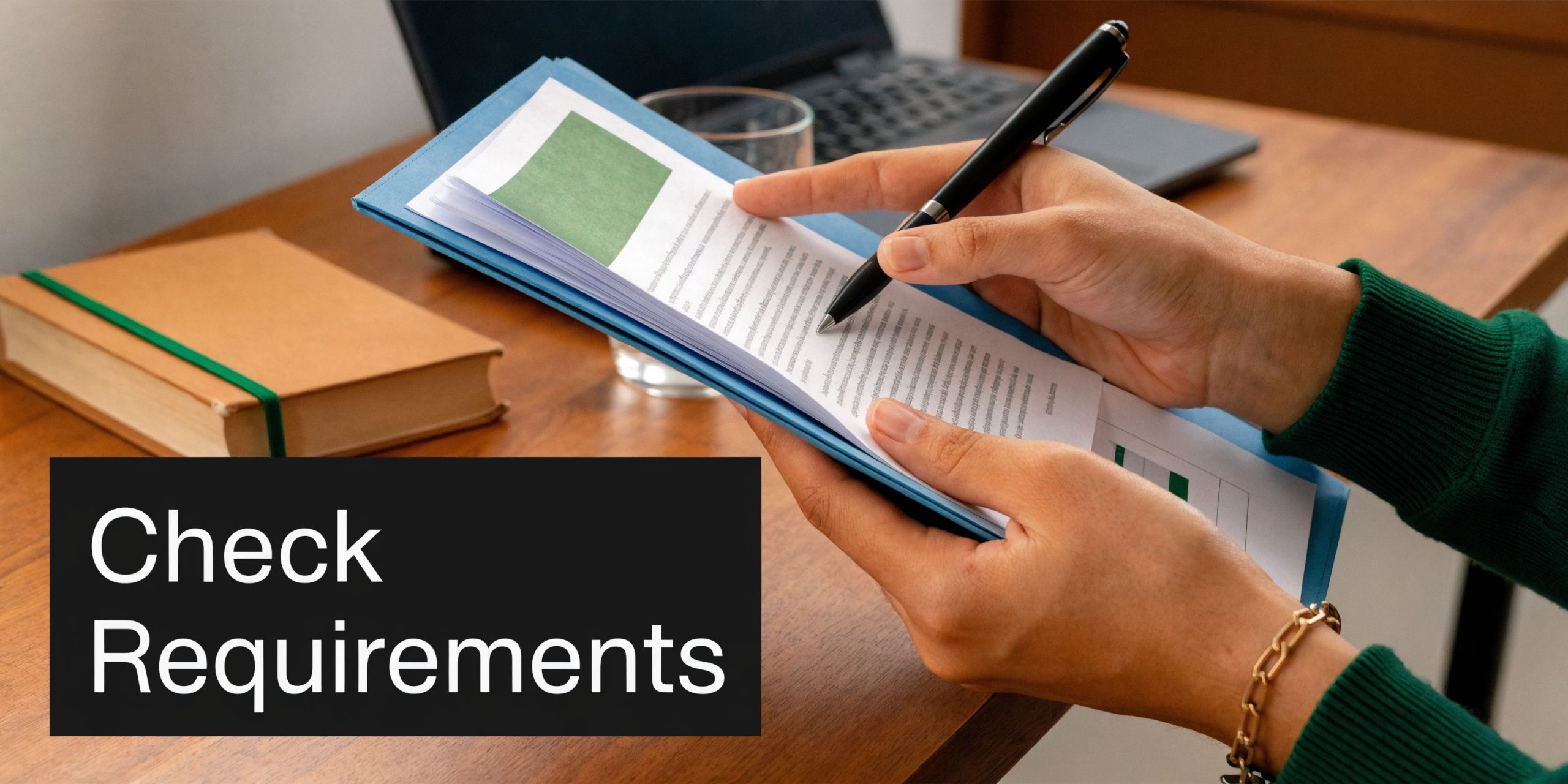 A professional reviewing medical documents regarding education in midwifery while seated at a wooden desk.