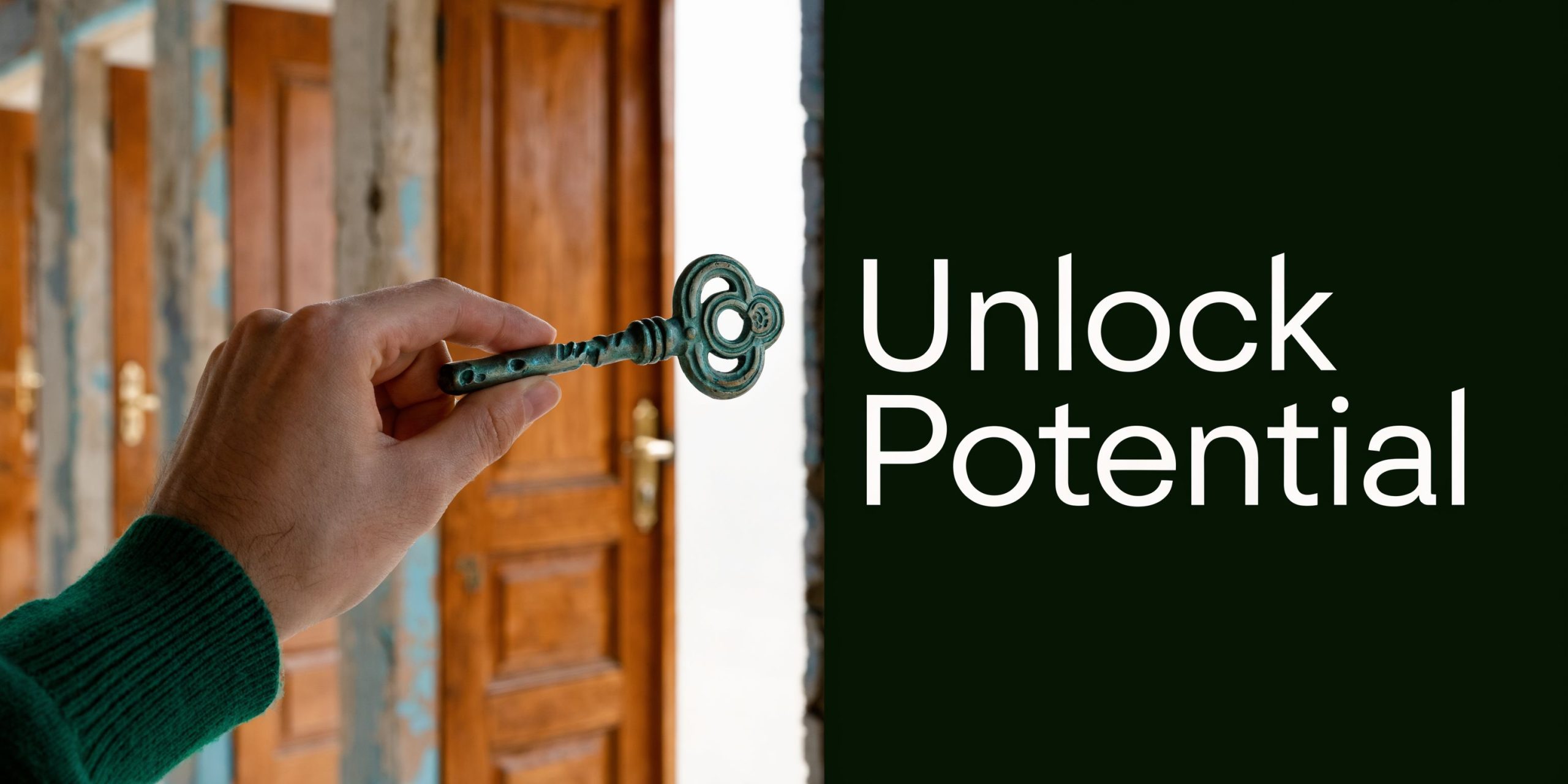 A hand holding an old key in front of open wooden doors with the text Unlock Potential