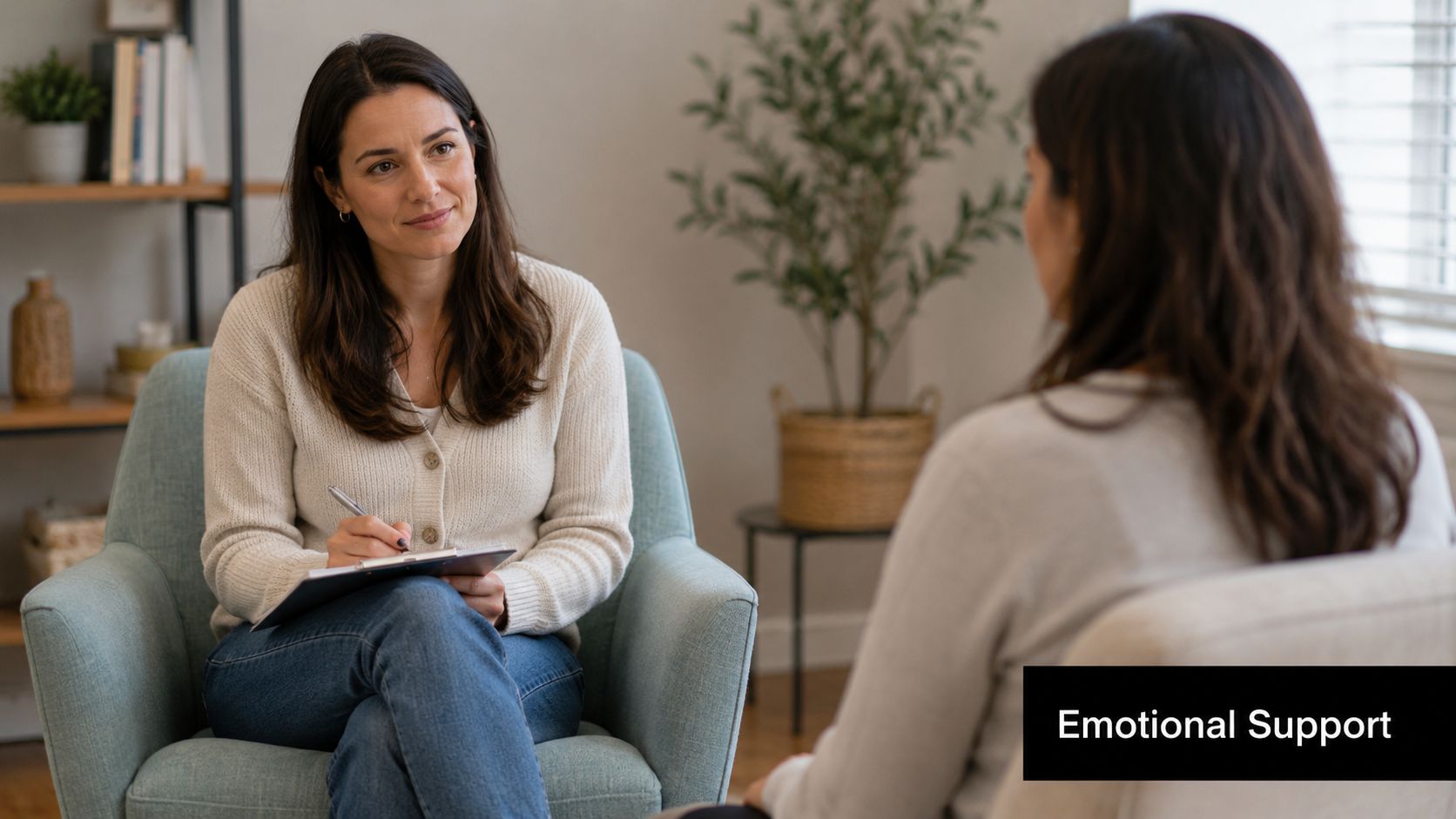 A professional female therapist listening attentively to a client during a supportive counseling session in an office.