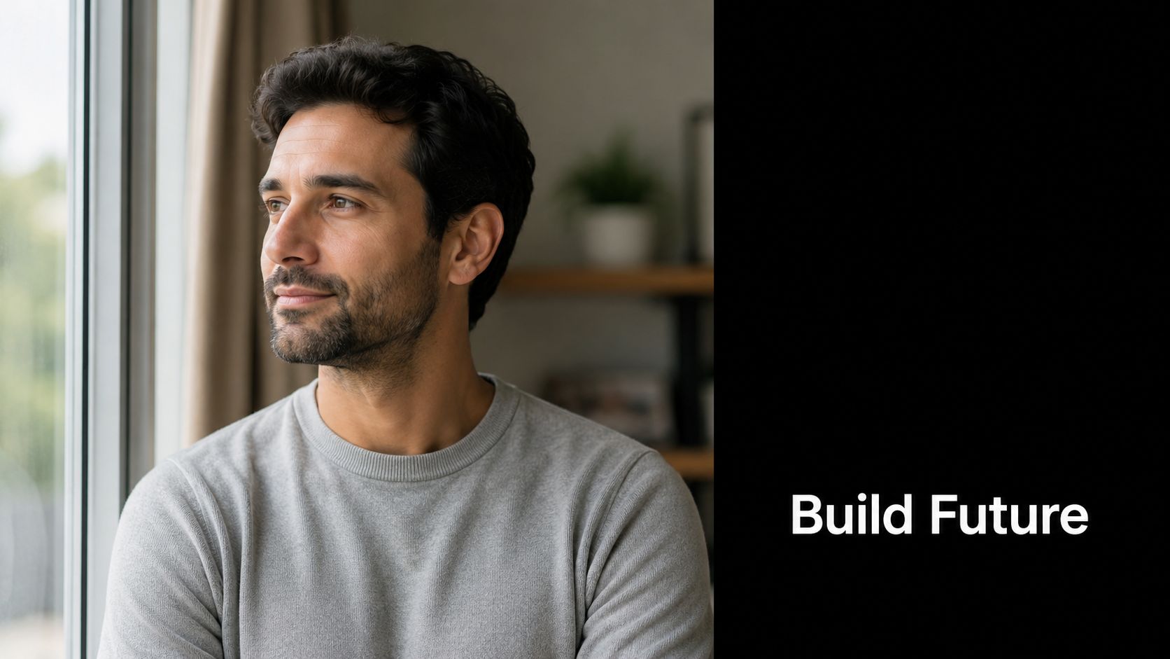 A thoughtful man looking out of a window with the text Build Future on the side.